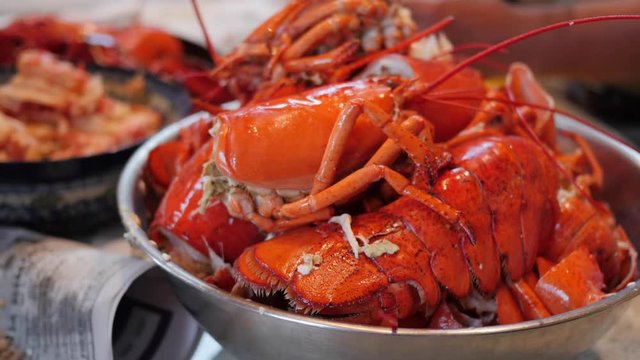 People preparing lobster for dinner