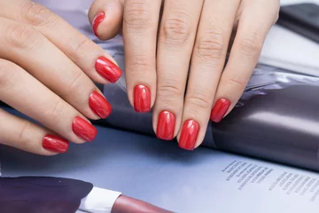 Gordijnen Beautiful natural nails and attractive manicure on women hands. © Vadim
