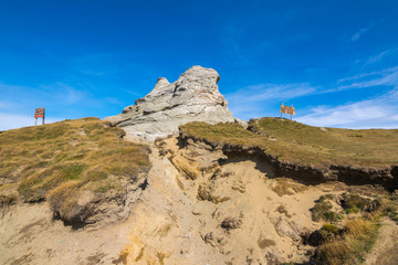 Fototapeta na wymiar Hiking trail The Burned Rock (Piatra Arsa), Caraiman Cross, The Old Women (Babele), Sphinx the Anthropomorphic megalith, Juniper Valley Bucegi National Park, Carpathians Mountains, Romania