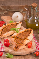 Turkish pide pizza with meat and onion. 