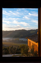 Beautiful grape fields in Chianti from the morning seen through the window in Chianti, Italy
