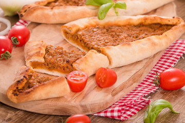 Fototapeta na wymiar Turkish pide pizza with meat and onion. 