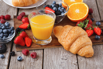 Fresh crusty croissants and orange juice for morning meals