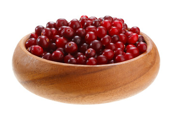 cranberries in a wooden bowl isolated on white background