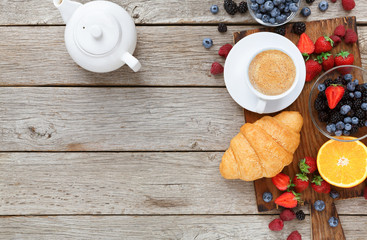 Tasty pastry, fruits and berries on rustic wood, top view