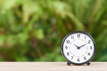 Alarm clock on table.
