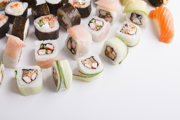 Set of sushi, maki and rolls on white background