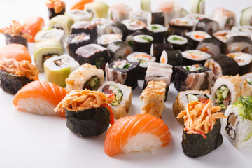 Set of sushi, maki and rolls on white background © Prostock-studio