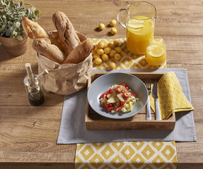 breakfast or light eating something plate and mat style orange juice with lemon and bread
