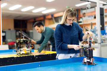 Young woman engineer working on robotics project