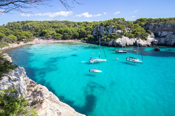 Fototapeta na wymiar Boats and yachts on Macarella beach, Menorca, Spain