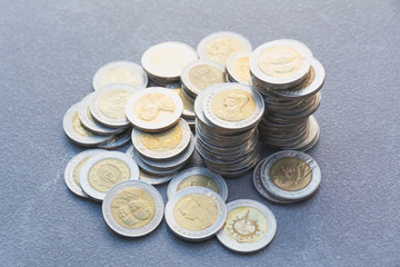 Closeup stack coin with table background. Financial and saving concept.