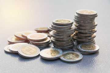 Closeup stack coin with table background. Financial and saving concept.