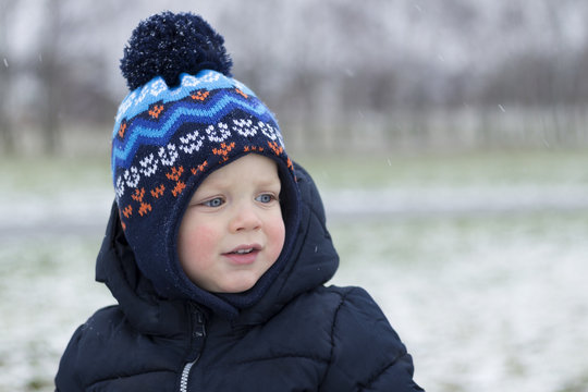 Cute Toddler With Red Cheeks Om The Frost. Winter Shot. Copy Space