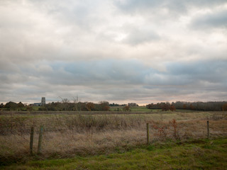 country green grassland plain field white clouds sky empty space