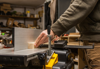 Woodworking, planing wood on a jointer
