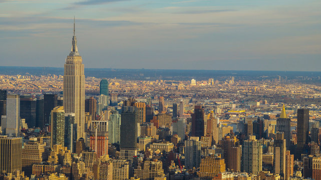 Aerial photograph of new york city in warm light with skyscrapers and tall buildings