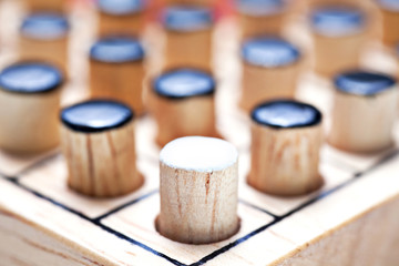 the one white in black of  Wooden Revessi Othello game close up of Different wood stick , Business concept, Selective focus