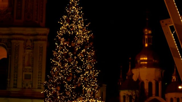 Christmas tree in the downtown. Flashing lights on the christmas tree.