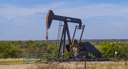Oil pump in the countryside of Oklahoma - Pump jack