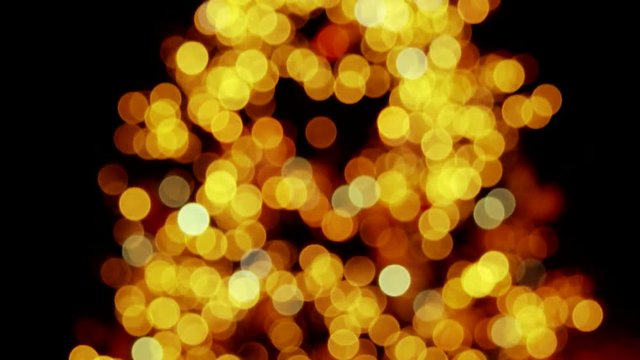 Increasing amount of transclusent circles. Many flashing circles. Orange and yellow circles.