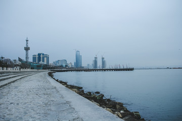 Panorama on the Baku Boulevard and Marine Passanger Terminal near Milli Park. National Park in Baku in the gray winter day.