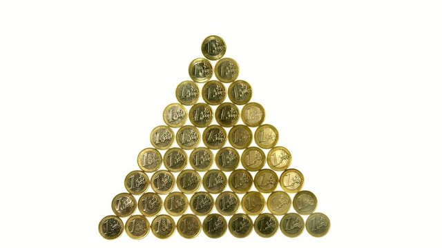 � coins create shape of a golden pyramide