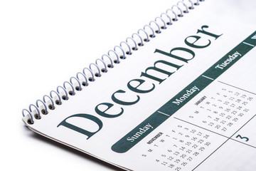 Desk top calendar December close up on white background