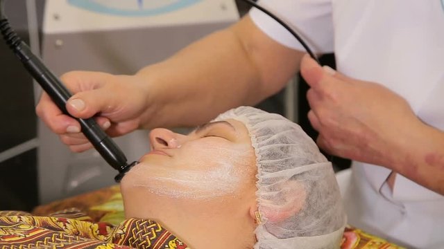 Facial treatment and lifting therapy massage from a doctor