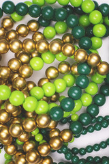 Texture of colored yellow, gold and green beads