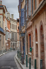 Fototapeta na wymiar Beautiful narrow street in the city center of Toulouse, France