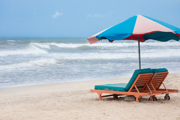 summer beach sun chairs lounger sunbed near perfect tropical sea