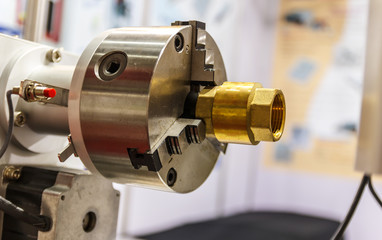 Close up Lathe holder and product part set on high precision CNC machine
