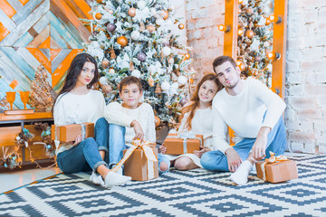 Fototapeta premium Family celebrating at home. father, mother and children on the b