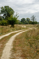 Old rural road in summertime.
