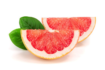 two slices of grapefruit with leaves isolated on white background