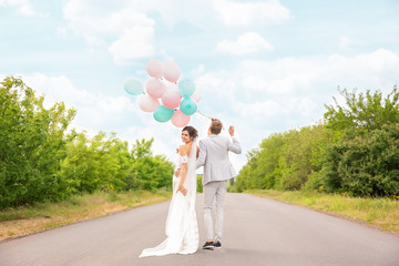 Happy beautiful couple on wedding day, outdoors