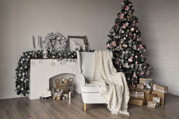 Christmas cozy place with a burning Christmas tree and white chair 9312.