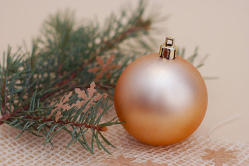 Vintage Christmas Golden Ball with Fir Branch Isolated. Copy Space.