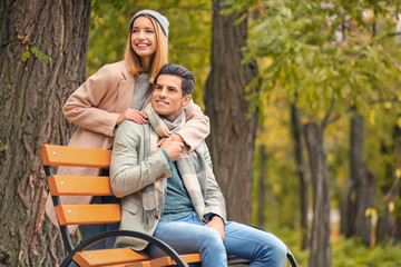 Fototapeta premium Young couple in park on autumn day