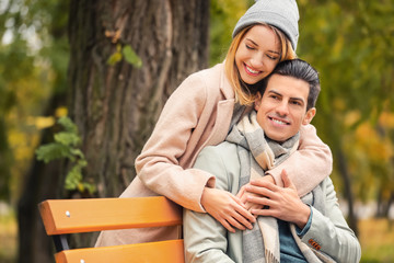 Fototapeta premium Young couple in park on autumn day