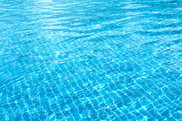 Obraz premium Ripple water in swimming pool with sun reflection