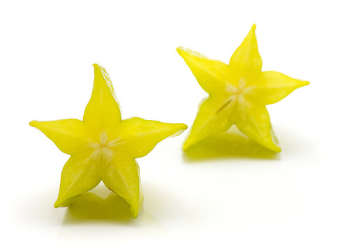 Carambola two halves isolated on white background.