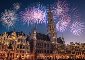 Zelfklevend Fotobehang View of the Grand Place (Grote Markt) at night with fireworks on the black sky  in Brussels, Belgium © Olena Zn