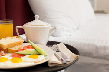 Breakfast in bed in hotel room
