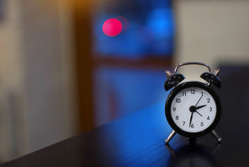 Alarm clock at hotel receptionl. Time concept.