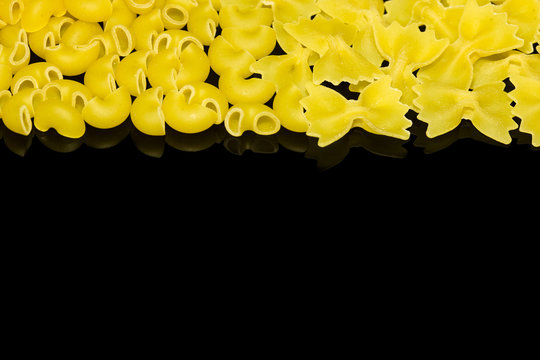 Farfalle, Lumache pasta isolated on black