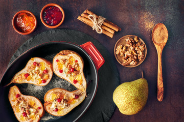 Pears baked with Blue cheese and walnuts, served with orange and cowberry jam on dark