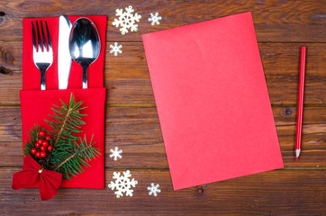 Naklejka na ściany i meble Background for writing the Christmas menu, red paper on old wooden table.