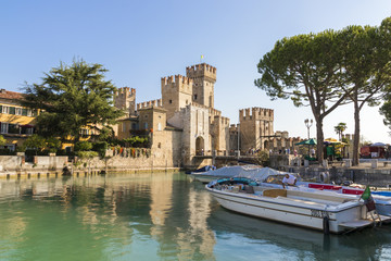 Fototapeta premium The Castello Scaligero or Scaliger castle, a 13th century medieval port fortification near Lago di Garda in Sirmione, Lombardy, northern Italy